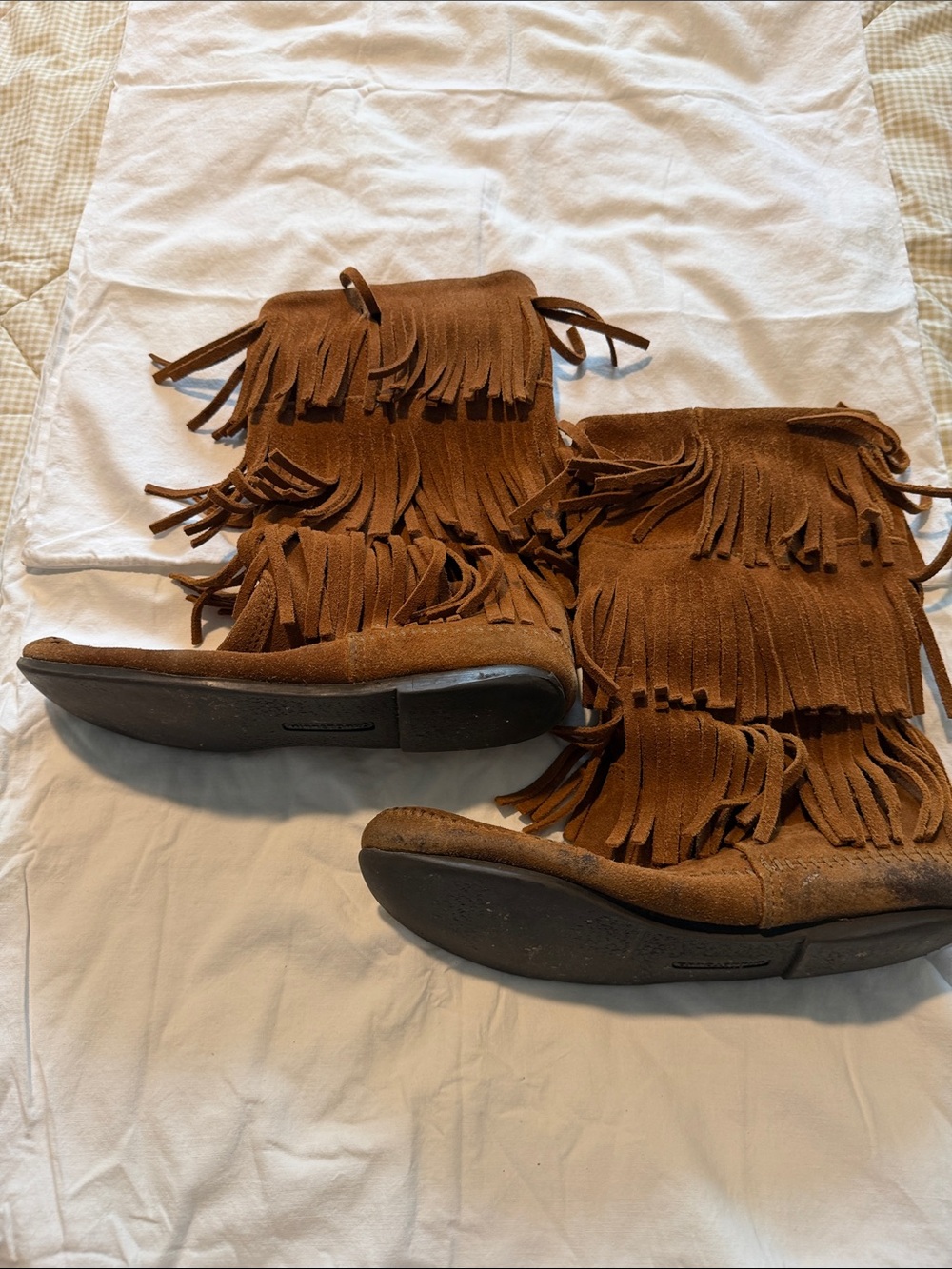 Minnetonka Fringe Suede Mid-Calf Boots in Brown. Three-tier